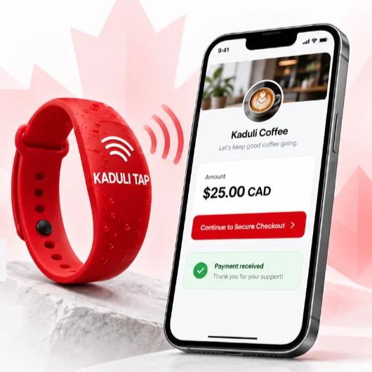 Red KADULI TAP waterproof silicone NFC wristband on a white stone pedestal with NFC waves reaching a smartphone showing the Kaduli Coffee secure checkout for $25.00 CAD and a payment received confirmation